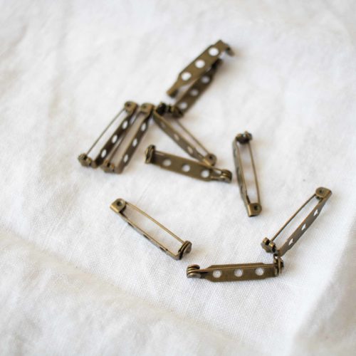 Lot 10 broches Bronze